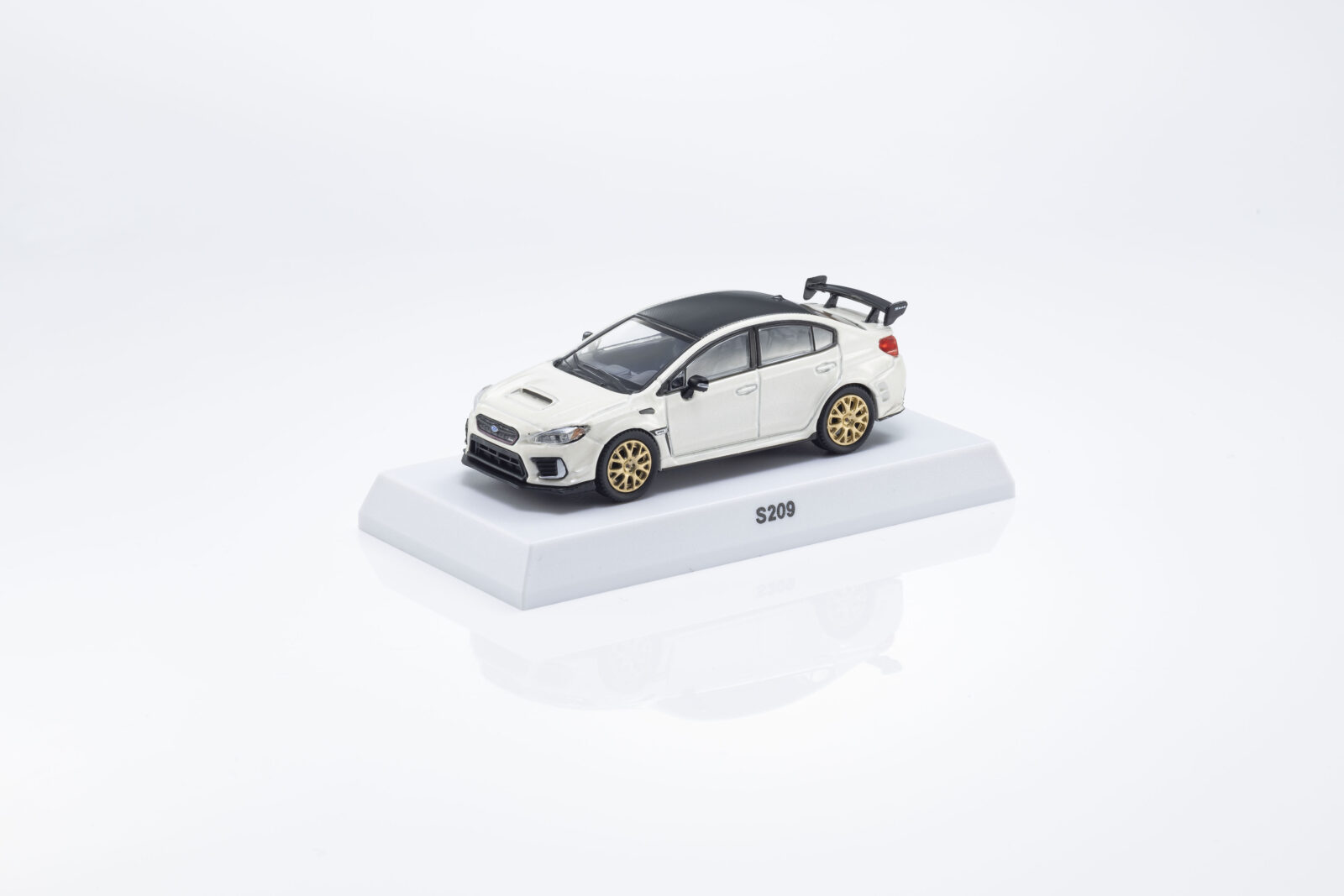 Subaru S209 + Libro DS Modellismo Subaru S209 Libro scala 1:64 Kyosho